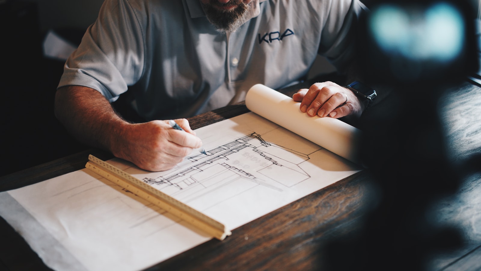RICS surveyor reviewing building plans